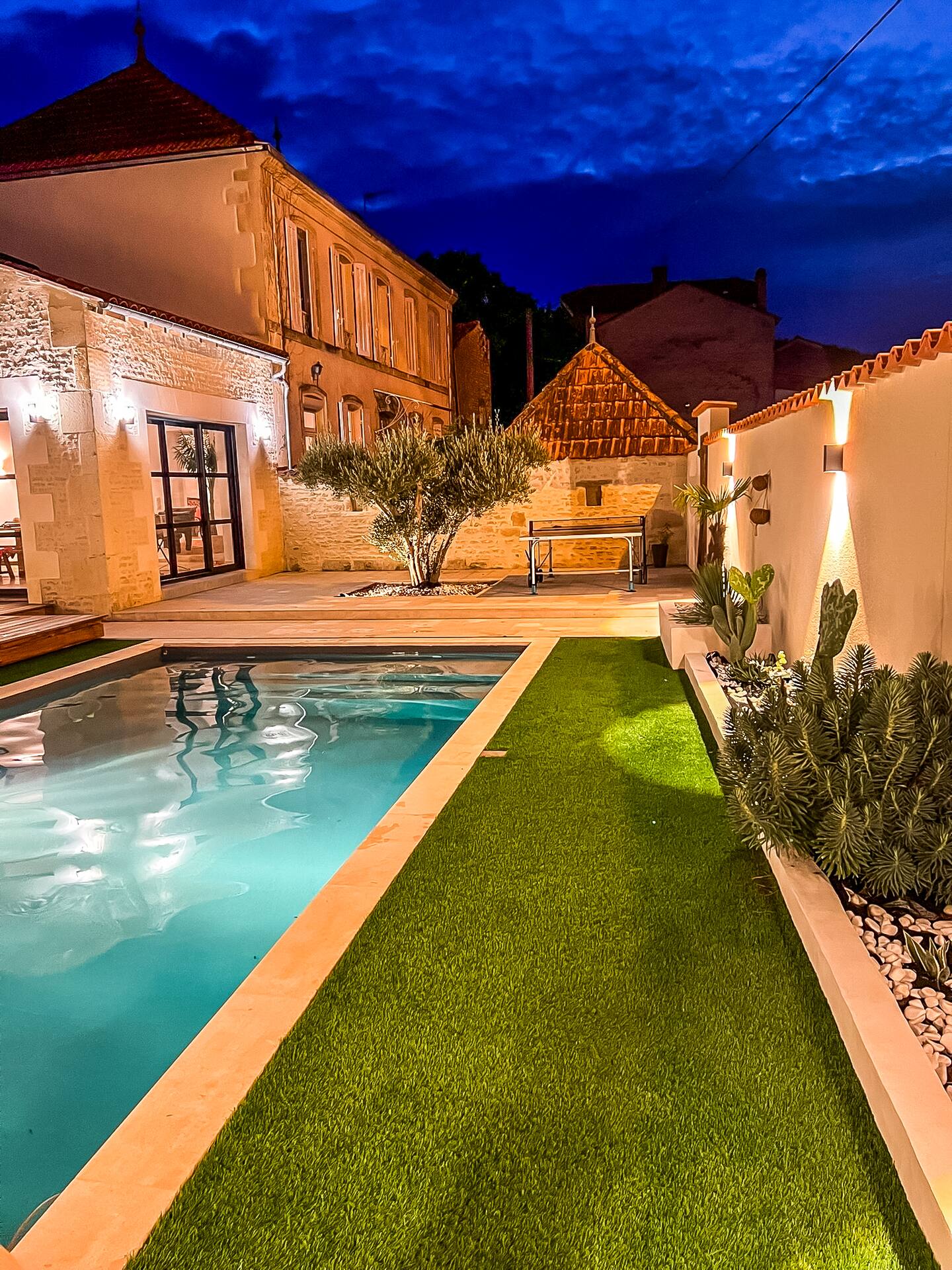 The grange illuminated at night